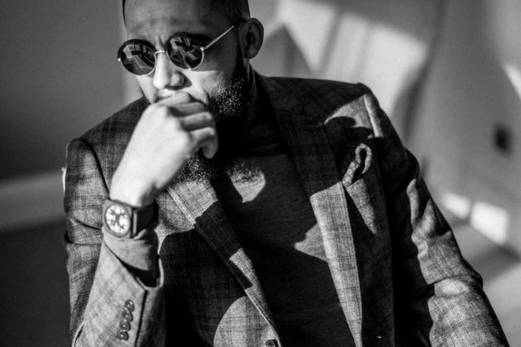 Jean-Claude Mpassy wearing Hackett London Suit and Bell & Ross watch