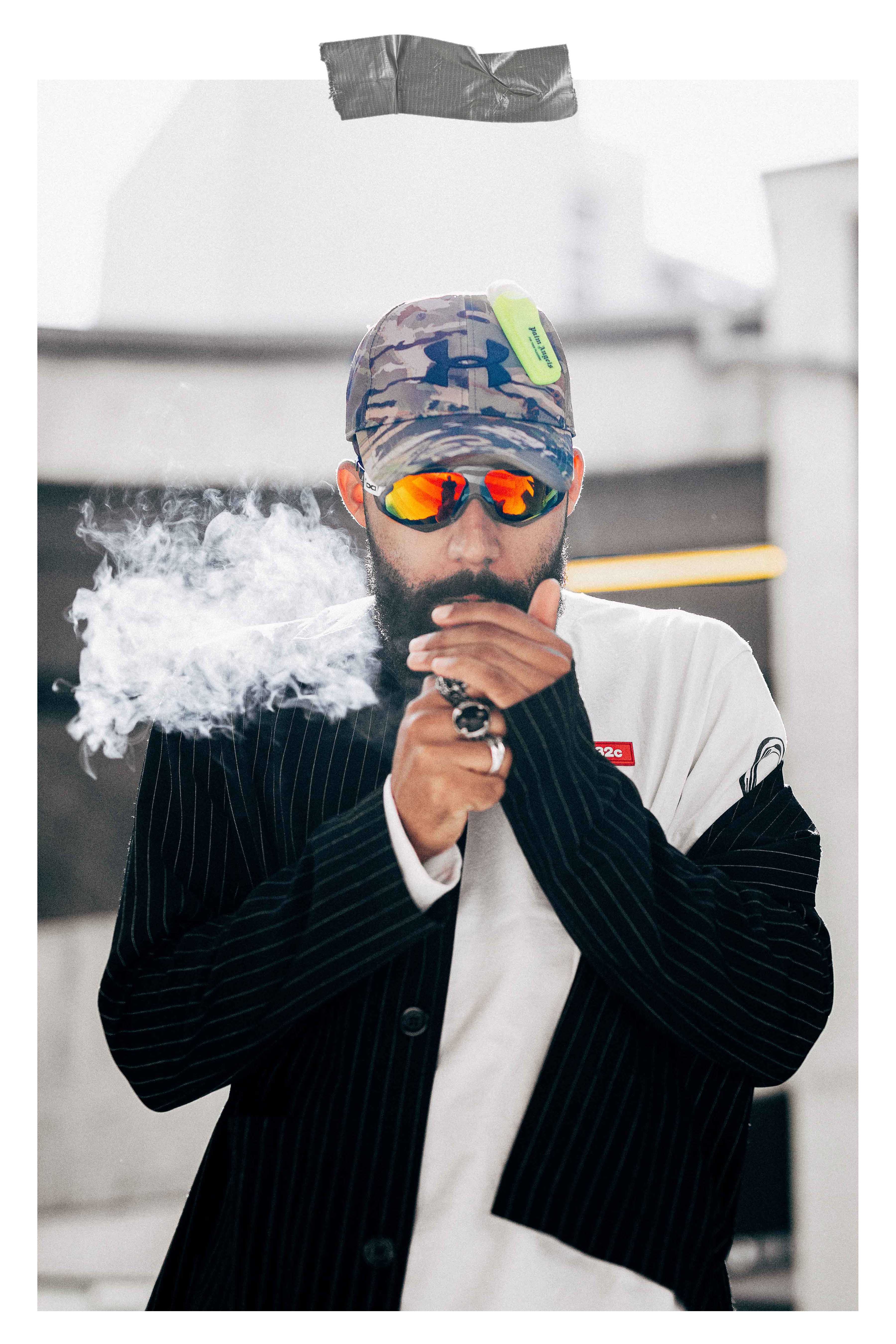 Jean-Claude Mpassy from New Kiss on the Blog wearing Under Armor X Palm Angels Cap adnd Gloryfy sunglasses